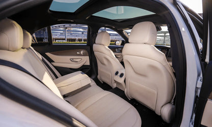 Rent Mercedes-Benz E350 AMG 2023 White or similar DRD Car Rental LLC